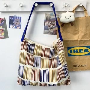 Large capacity canvas tote bag with multi-color vertical stripes and blue strap