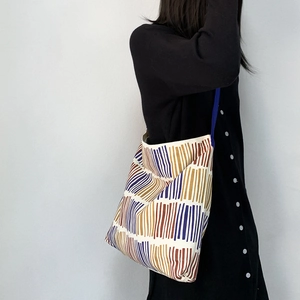 Detail view of the abstract stripe canvas tote bag showing its fabric texture and durability