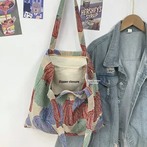 Detail of vintage pumpkin jacquard tote bag showing top zipper closure and inner pocket