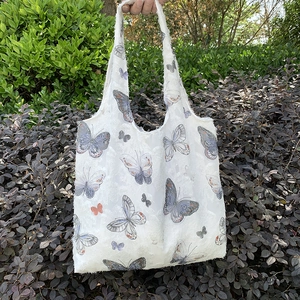Minimalist canvas tote bag with butterfly embroidery and large capacity for daily use