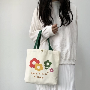 Borsa tote in tela con stampa floreale Have a nice Day e manici verdi a contrasto