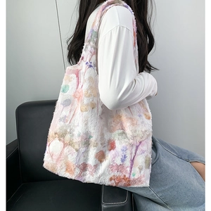Detailed view of colorful 3D tassel floral jacquard texture on large tote bag