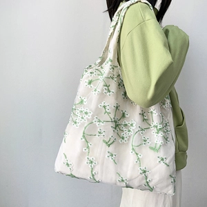 White mesh lace tote bag with green floral embroidery for casual beach or daily use