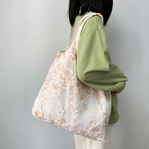 Floral embroidered mesh lace tote bag with white flower pattern for beach and casual use