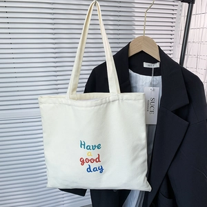 Minimalist canvas tote bag with 'Have a good day' lettering for daily travel and commute