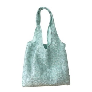 Mint green canvas tote with white daisy floral embroidery and mesh lace texture