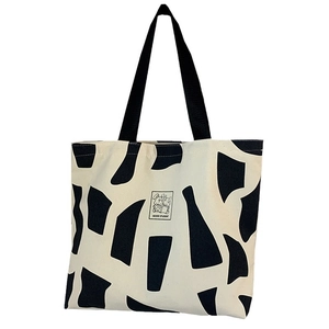 Minimalist canvas tote bag with cow print and Good Student rabbit patch for women