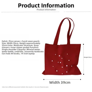 Detail view of red canvas tote bag showing pearl beads, snap button, and interior zipper pocket