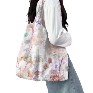 Spacious canvas tote bag with colorful 3D texture and artistic floral pattern on model