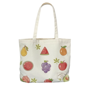 Fresh canvas tote bag featuring vibrant hand-painted fruit prints and vintage woven label