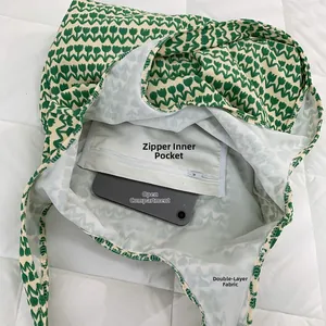 Detail view of the tulip canvas tote interior showing zipper pocket and tablet compartment