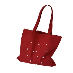 Minimalist deep red canvas tote bag with pearl accents for women daily commuting fashion