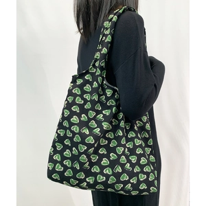 Japanese style black tote bag with green heart patterns and large shoulder capacity