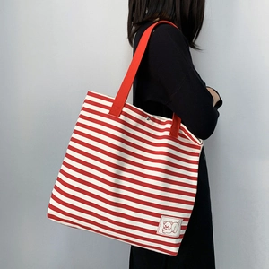Red and white striped large canvas tote bag with red shoulder strap and cute bear patch