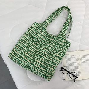 Close-up of green tulip pattern on a thick high-density canvas tote bag with wide straps