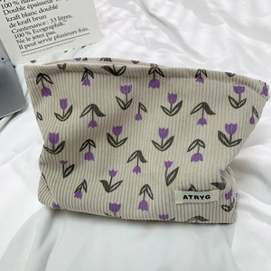 Floral corduroy makeup bag with tulip pattern and zipper closure for cosmetics