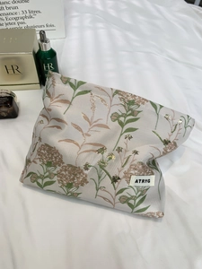 Floral jacquard travel cosmetic bag with elegant leaf patterns and spacious storage