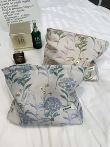 Floral embroidery portable cosmetic bags in blue and pink for travel storage