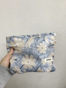 Floral jacquard travel makeup bag with blue daisy pattern and portable rectangular shape