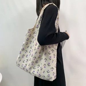 Corduroy tote bag featuring purple tulip pattern on beige fabric for daily commute