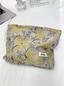 Floral jacquard large capacity makeup bag with yellow daisy pattern and ATRYG label