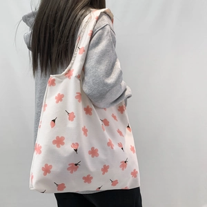 Floral canvas tote bag in cream white with pink cherry blossom print for daily shopping