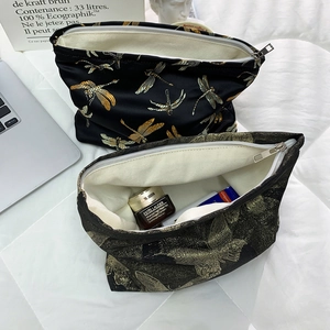 Large capacity makeup bag with gold dragonfly and butterfly embroidery on black fabric