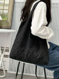 Elegant black tote bag with 3D embossed rose pattern for stylish office and daily commute