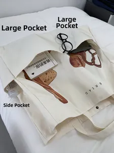 Detailed view of the large capacity white canvas tote bag with multiple pockets and bread print