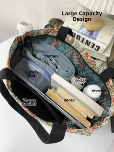 Macro view of blue floral tote bag interior showing large storage space and phone pocket