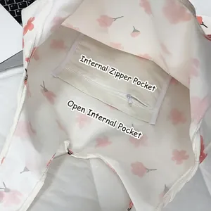 Floral canvas tote bag with internal zipper and open pockets for organized storage
