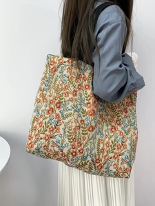 Detailed texture of Monet blue sunflower tapestry tote bag with floral embroidery