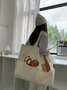 Large capacity off-white canvas tote bag featuring a realistic bread illustration print