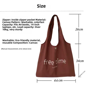 Detailed view of the brown canvas tote bag featuring free time Coffee print and size specs