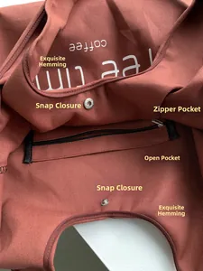 Detailed interior of red canvas tote bag showing magnetic snap and zipper pocket