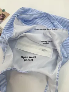 Detail view of the tote bag interior with dual-layer fabric and functional pockets