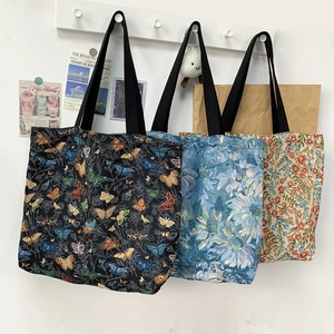 Detailed comparison of three large tote bags featuring floral and butterfly jacquard patterns
