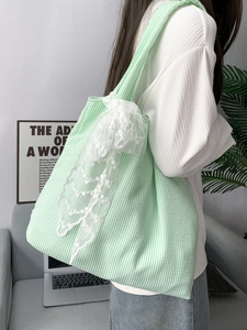 Green and white striped canvas tote bag with delicate lace bow for women