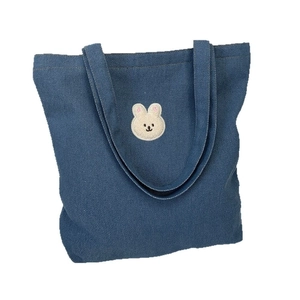 Dark blue denim tote bag featuring cute white rabbit embroidery and sturdy shoulder straps