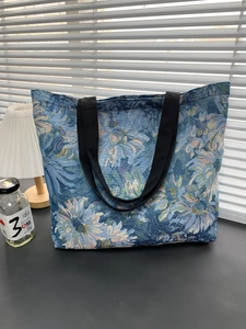 Close-up of Monet sunflower jacquard tote bag showing artistic floral fabric texture