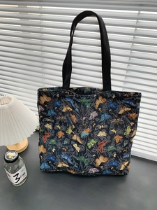 Detailed view of butterfly jacquard fabric texture and sturdy black woven straps