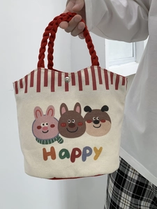 Detail view of canvas tote bag showing red rope handles and happy animal prints