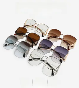 Detailed grid of oversized square sunglasses with metal chain temples and gradient lenses