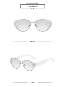 Detail view of pink and silver polygonal sunglasses with side letter accents and metal frames