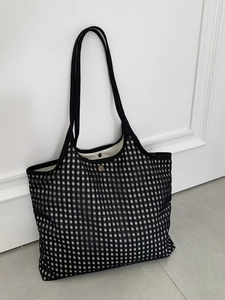 Minimalist black and white checkerboard tote bag with mesh fabric and shoulder straps