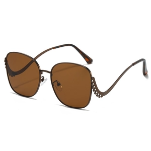 Fashion oversized sunglasses with brown lenses, wavy rhinestone temples and bronze metal frame