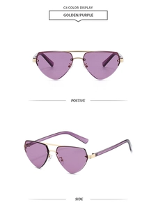 Close-up of golden metal frame and purple gradient lenses on heart-shaped sunglasses