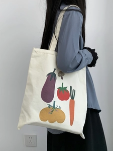 Borsa tote in tela bianco sporco con illustrazioni di verdure a fumetti e tracolle doppie