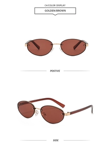 Détail de lunettes de soleil ovales en métal doré avec verres marron et branches rétro