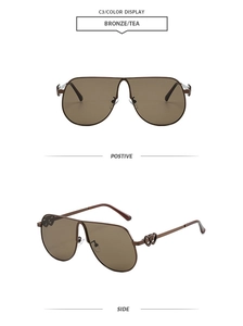 Detail of bronze pilot sunglasses with tea lenses and heart-shaped temple accents